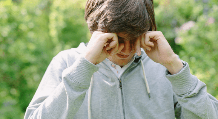 Man rubbing his eyes